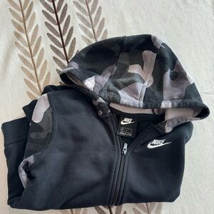 Boys size medium, Nike, zip up sweatshirt with camo black sleeves and hood